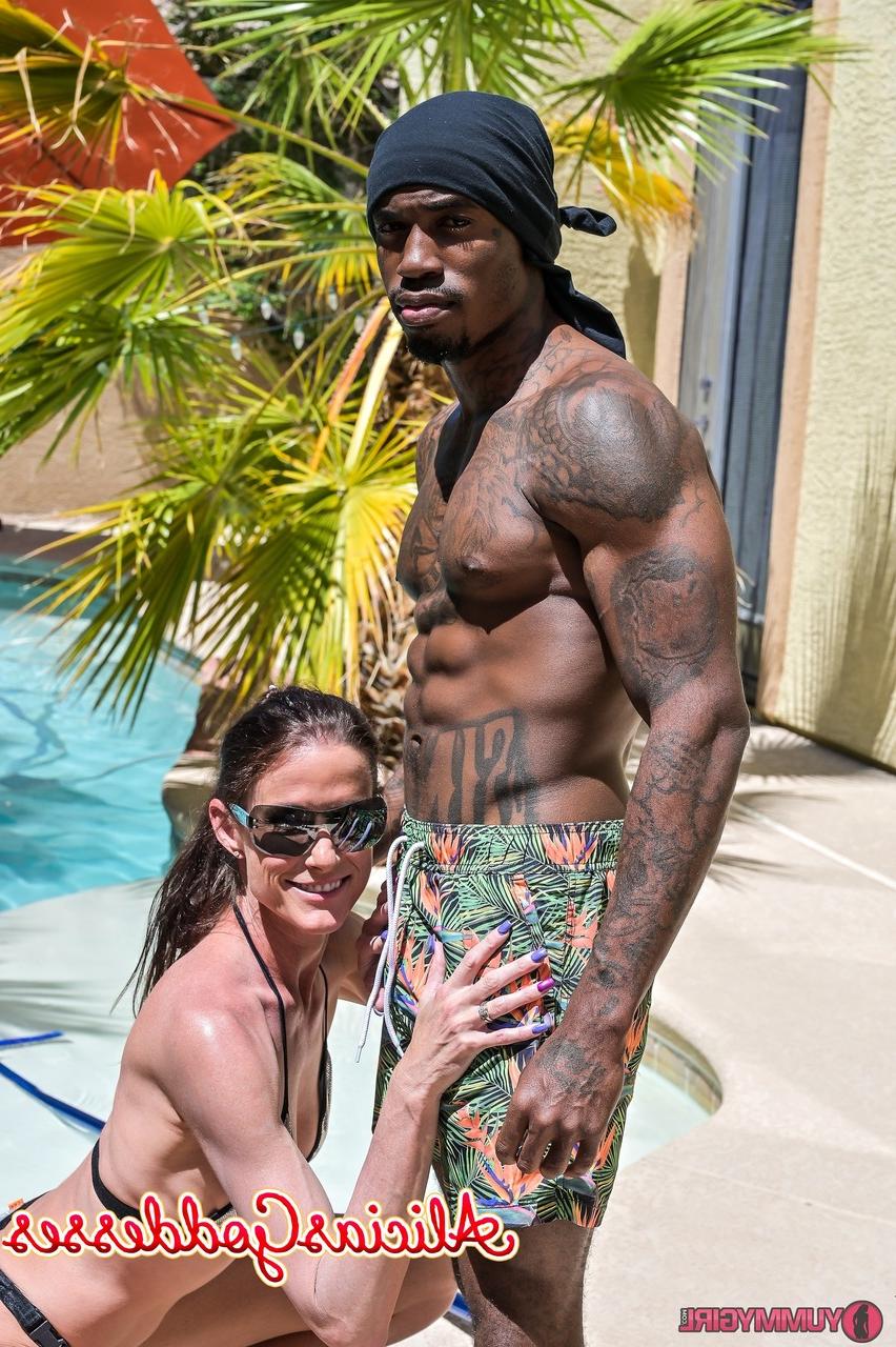 20P Tall brunette Sofie Marie blowing off a black muscular pool boy