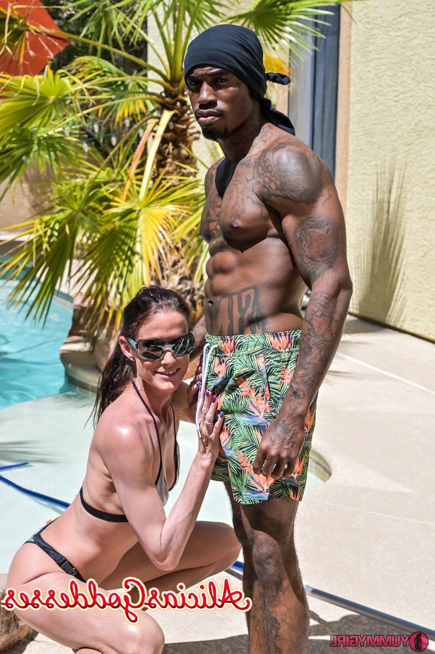 20P Tall brunette Sofie Marie blowing off a black muscular pool boy
