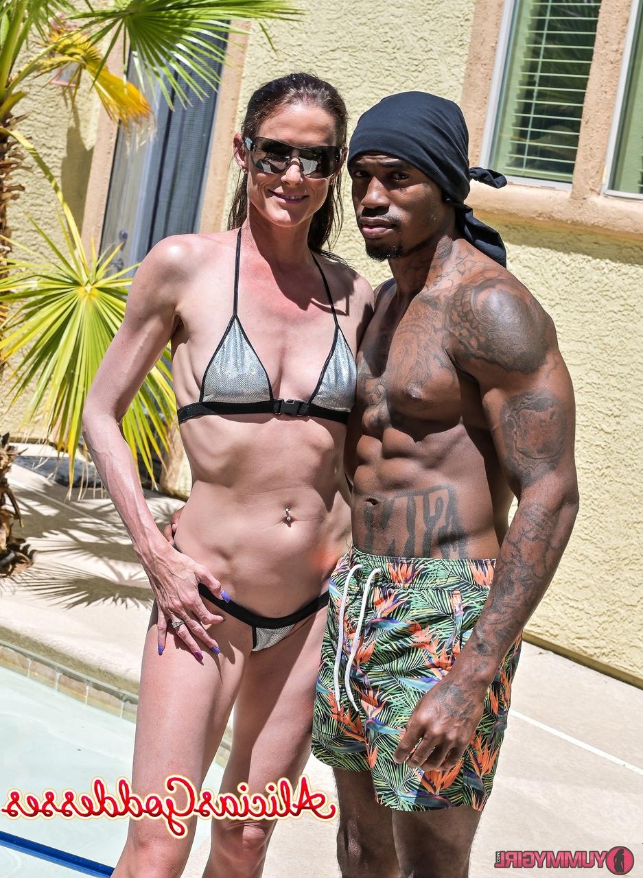 20P Tall brunette Sofie Marie blowing off a black muscular pool boy