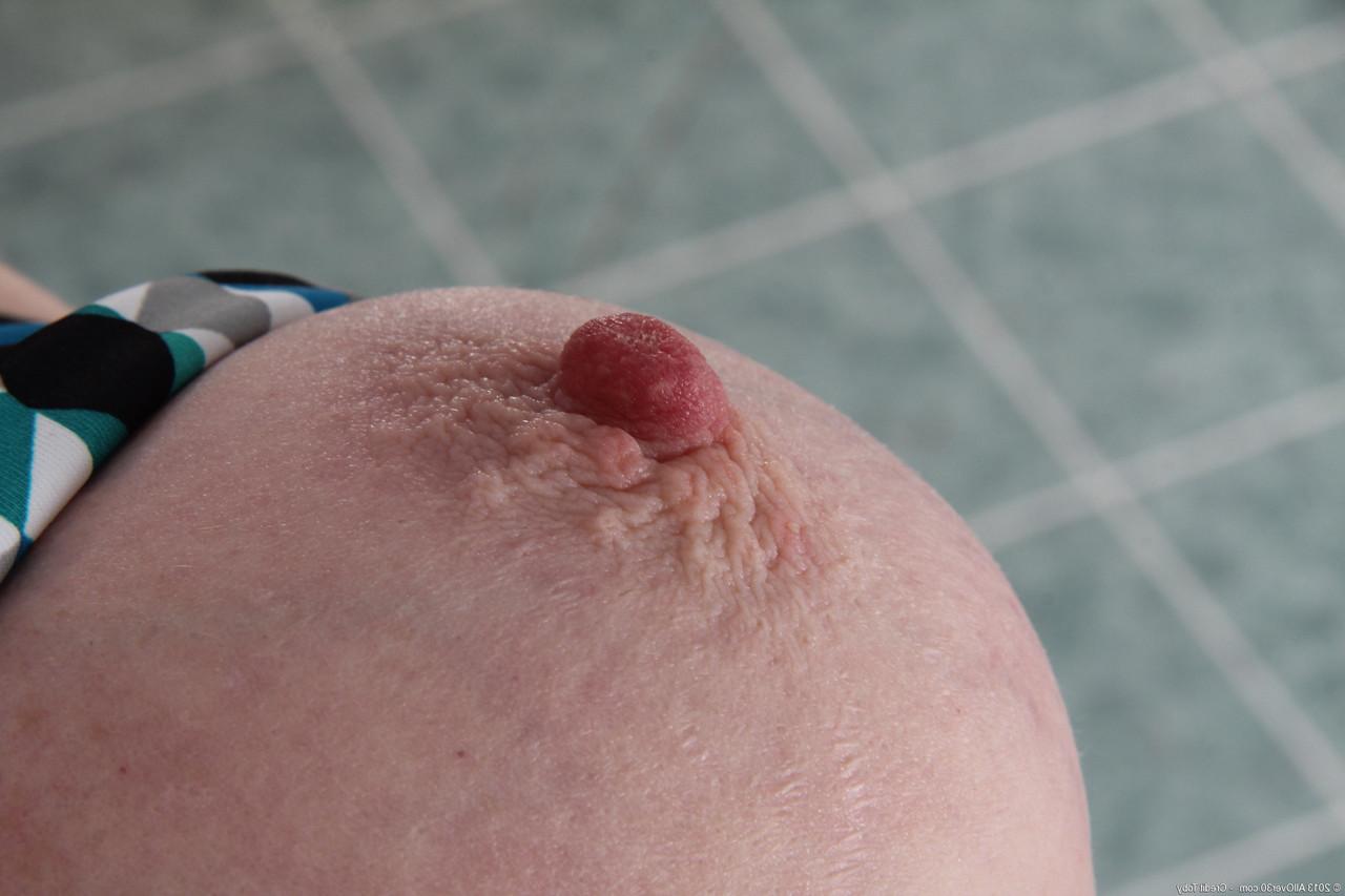 20P Mature ginger Tami Estelle strips and touches herself after working out
