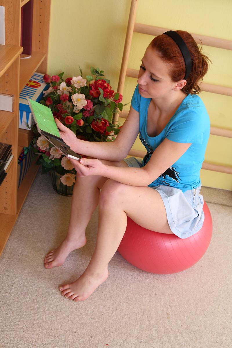 15P Young looking redhead Alka gets totally naked before touching her bald pussy