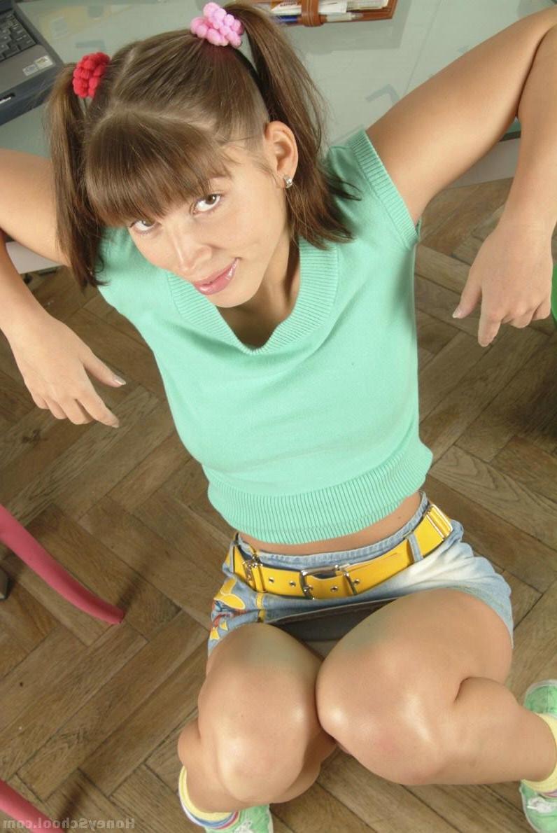 20P Pigtailed Hungarian cutie Adela T stripping and posing naked on her desk