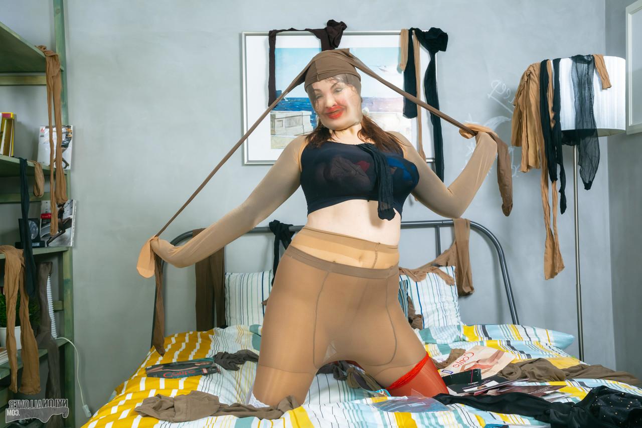 16P Pale redhead Eva Berger sports red lips during nylon encasement action