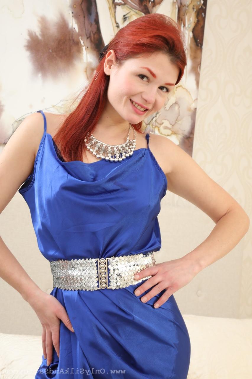 16P Pale redhead Freya H removes a long gown to go naked in stockings