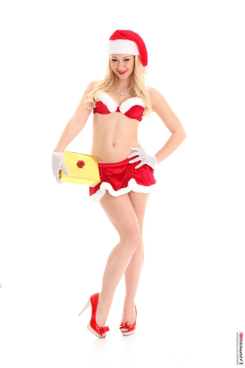 15P Sexy blonde Tracy Lindsay removes Christmas lingerie during a solo shoot