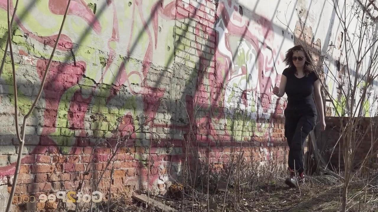 15P Brunette chick Alexa takes a piss after entering an abandoned building