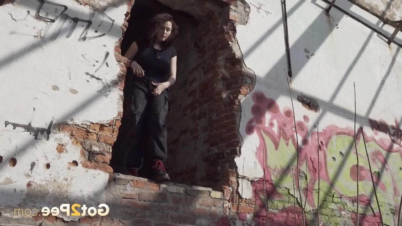 15P Brunette chick Alexa takes a piss after entering an abandoned building
