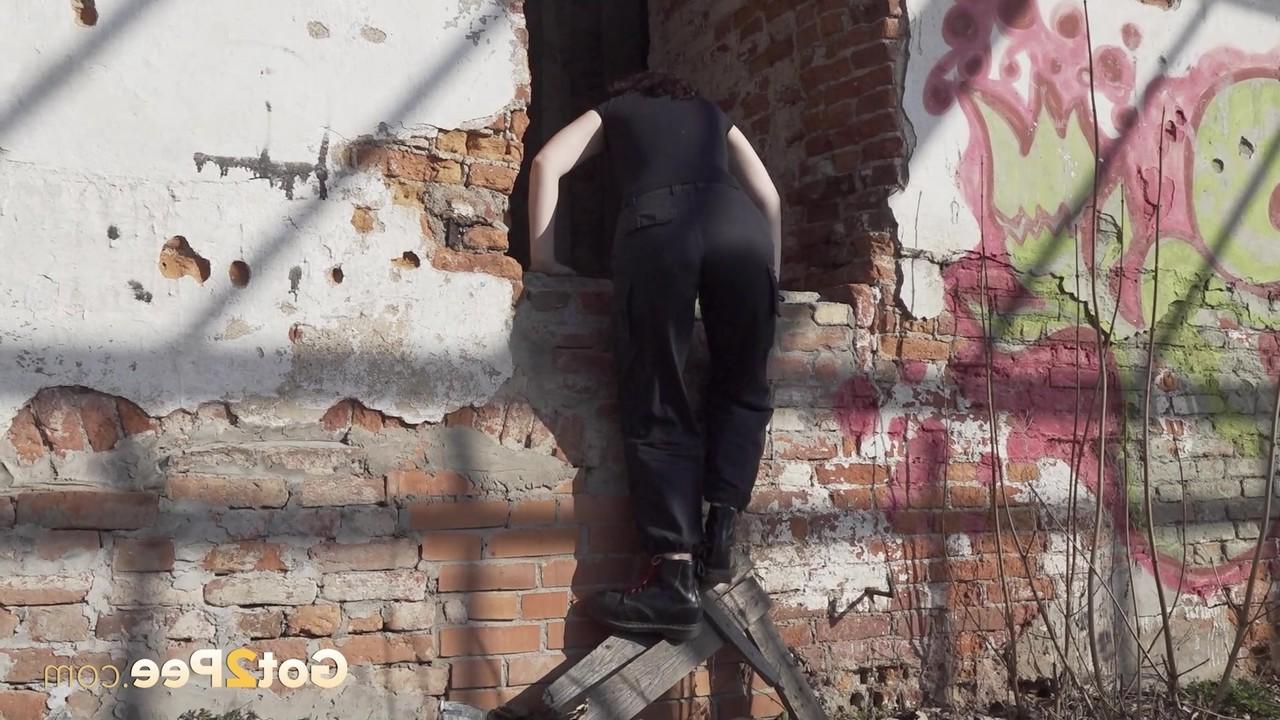 15P Brunette chick Alexa takes a piss after entering an abandoned building