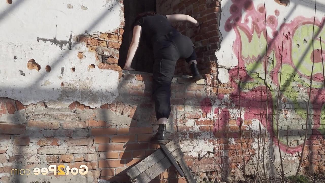 15P Brunette chick Alexa takes a piss after entering an abandoned building