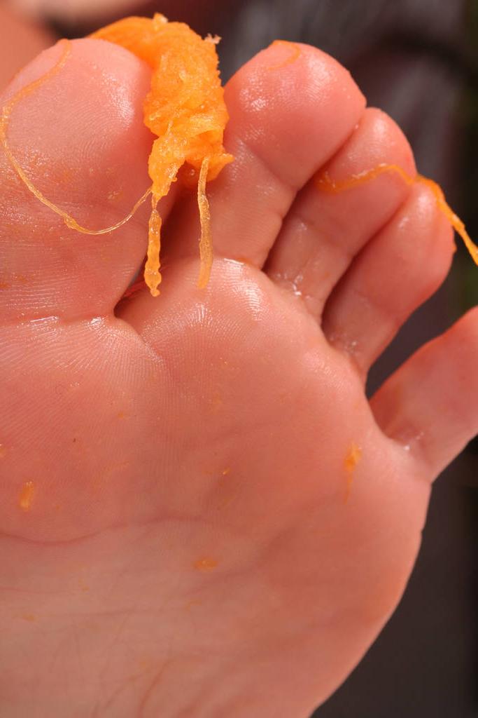20P Beautiful brunette Eve Angel crushes a pumpkin with her pretty feet