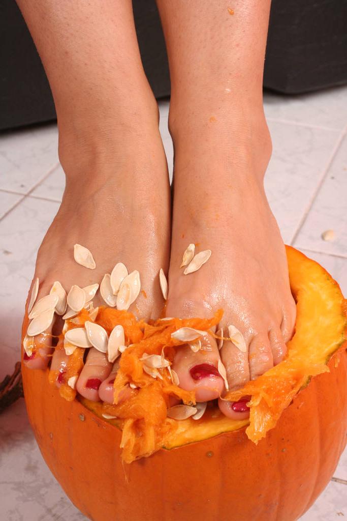 20P Beautiful brunette Eve Angel crushes a pumpkin with her pretty feet