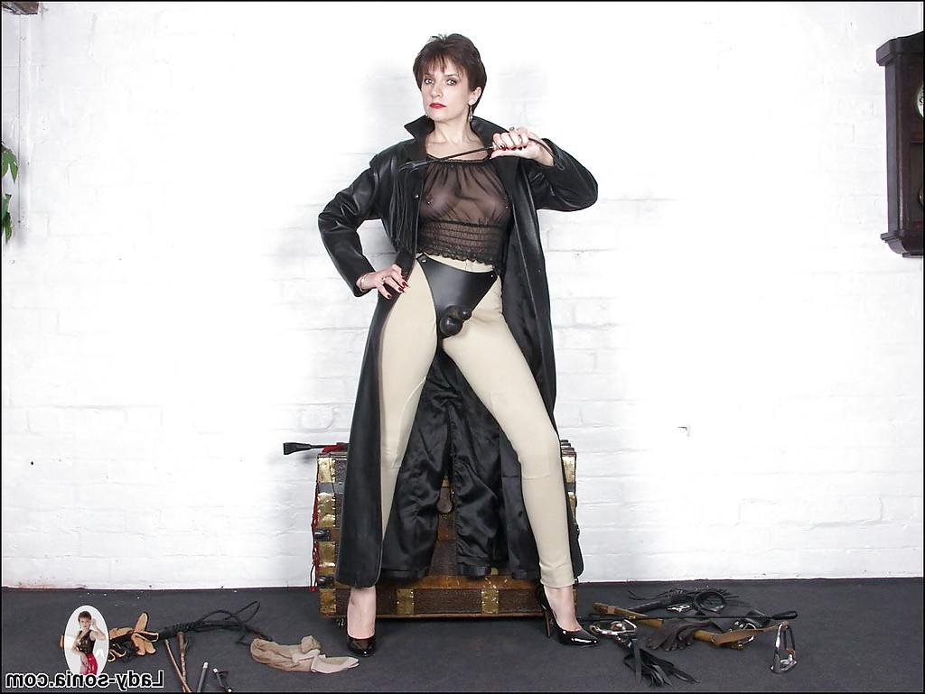 15P Fully clothed mature fetish babe posing with strapon over her pants