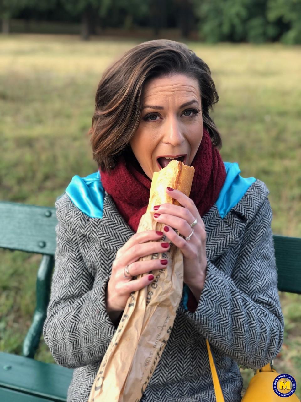 20P French mom Anya flashes her legs in stockings while eating a sandwich outside