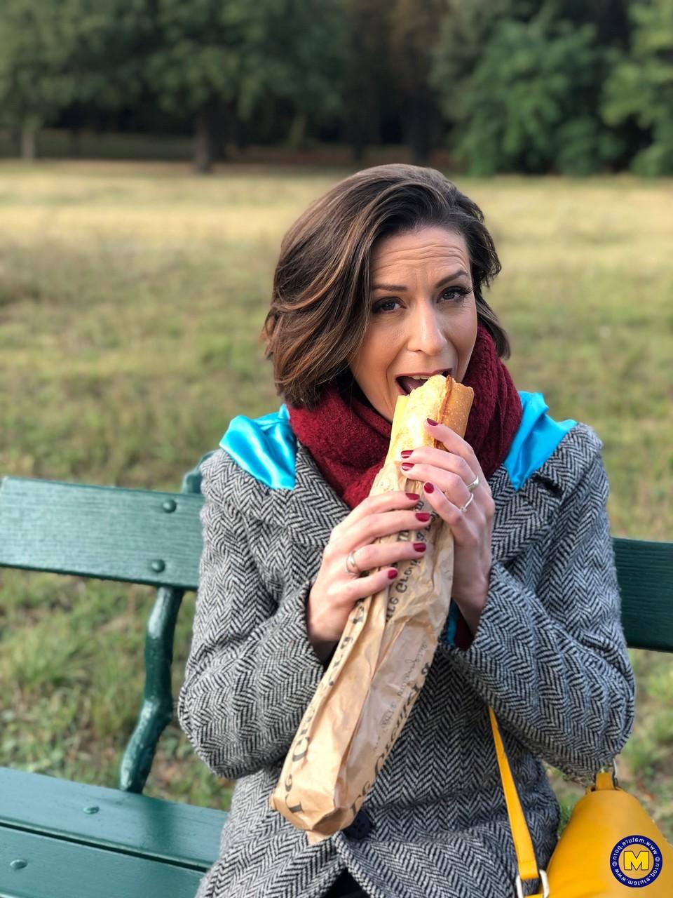 20P French mom Anya flashes her legs in stockings while eating a sandwich outside