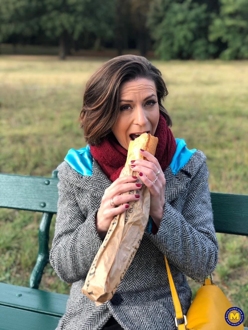 20P French mom Anya flashes her legs in stockings while eating a sandwich outside