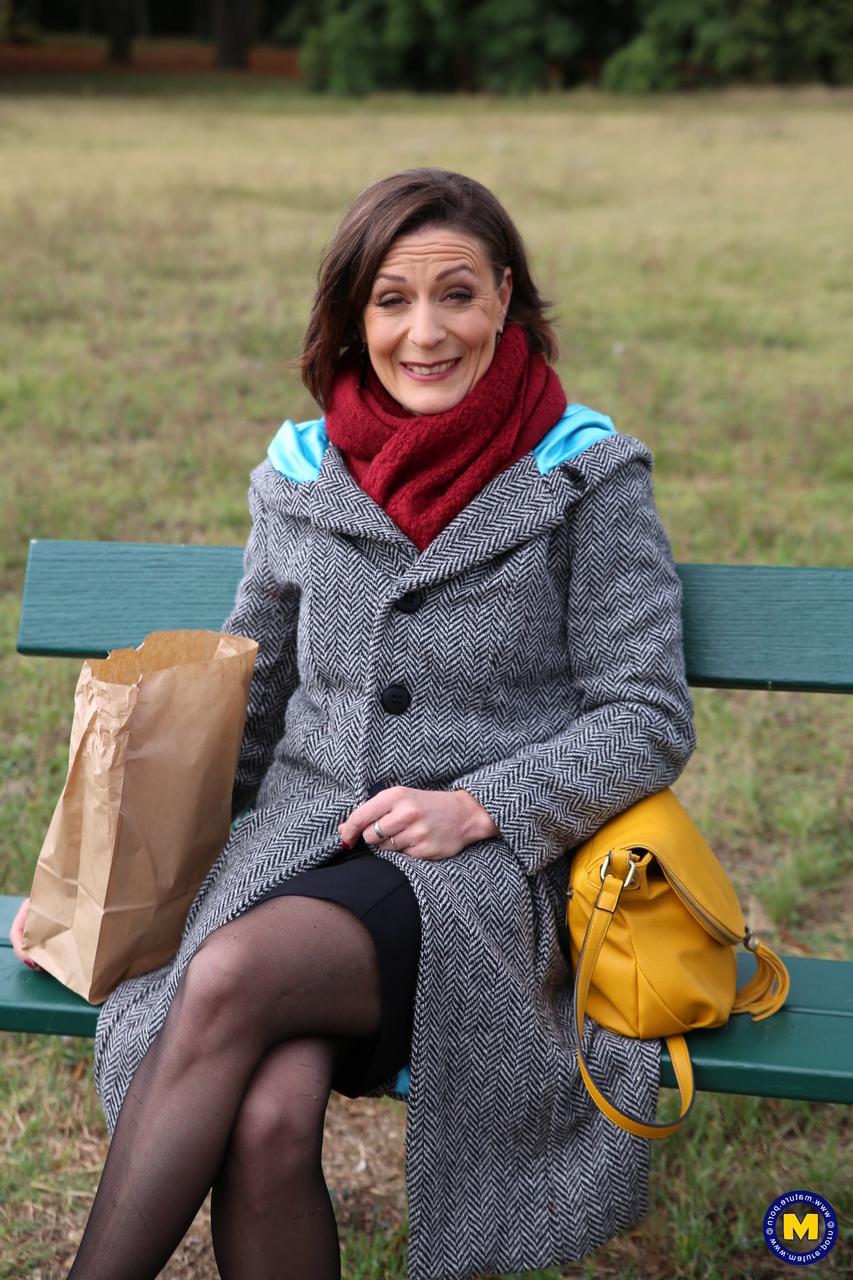 20P French mom Anya flashes her legs in stockings while eating a sandwich outside