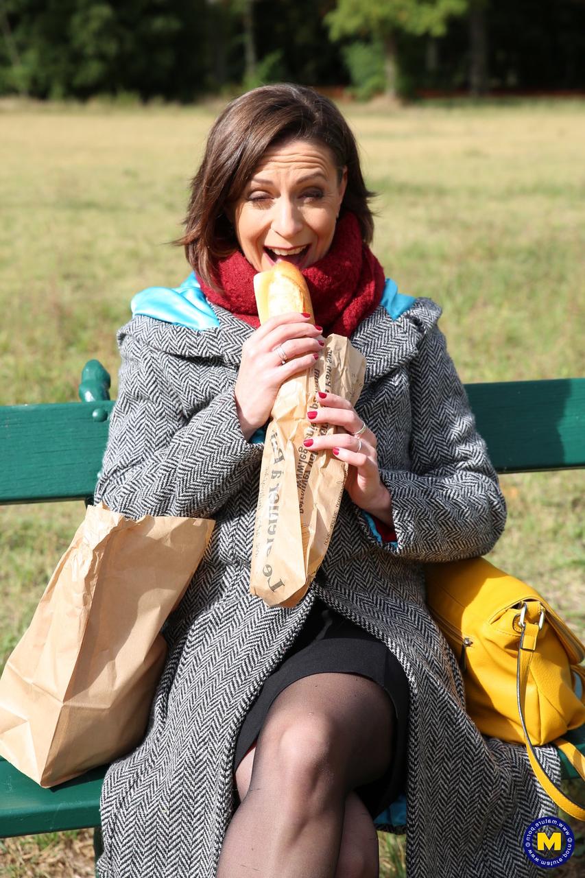 20P French mom Anya flashes her legs in stockings while eating a sandwich outside