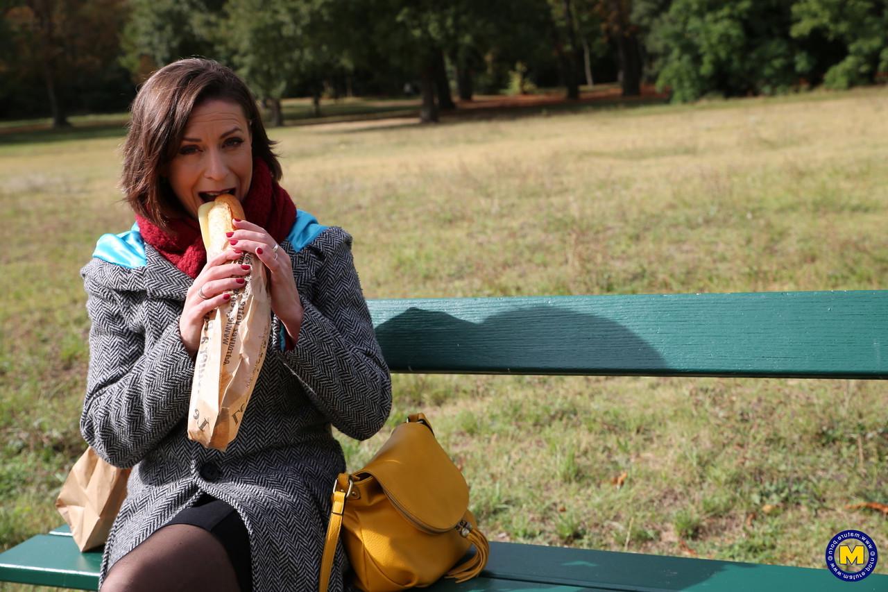 20P French mom Anya flashes her legs in stockings while eating a sandwich outside
