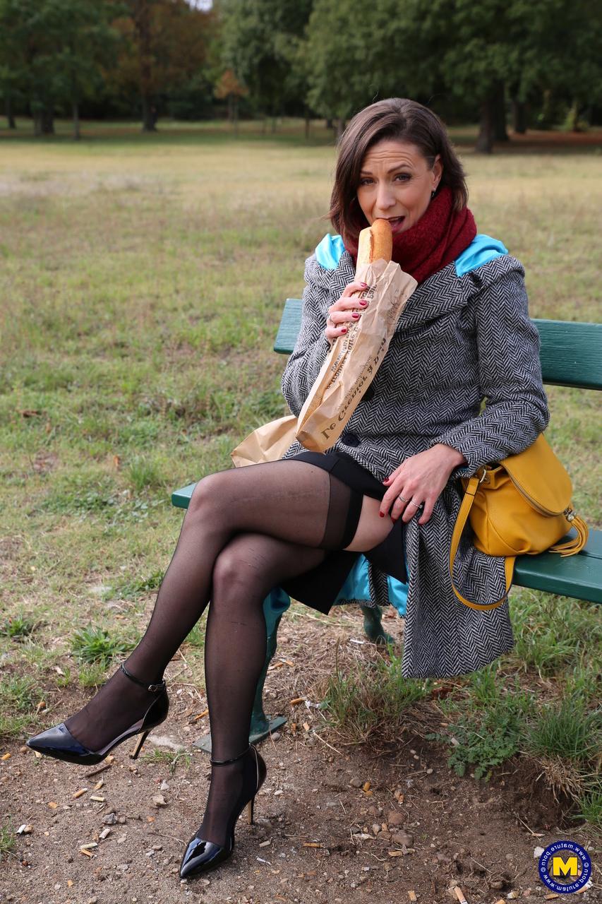 20P French mom Anya flashes her legs in stockings while eating a sandwich outside