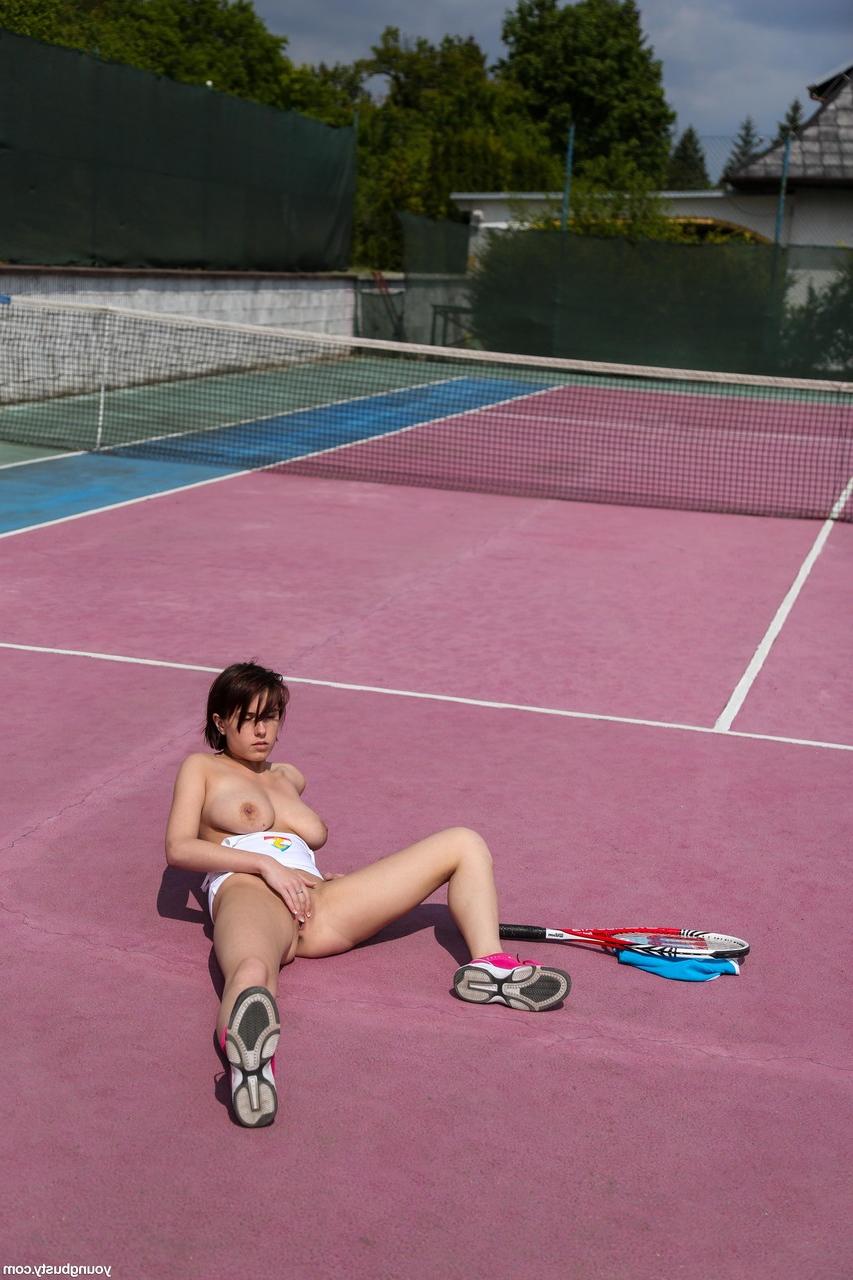 20P Teen with big tits Anabelle rubs and fingers her twat on a tennis court