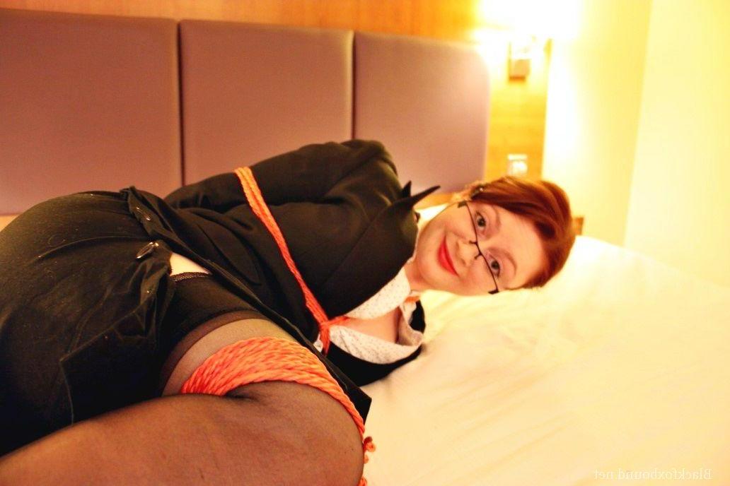 16P Natural redhead is tied up in her secretarial clothing and gagged as well