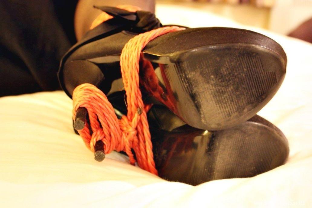16P Natural redhead is tied up in her secretarial clothing and gagged as well