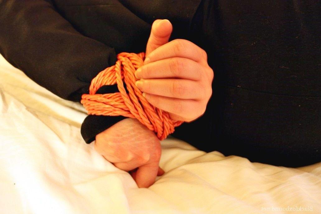 16P Natural redhead is tied up in her secretarial clothing and gagged as well