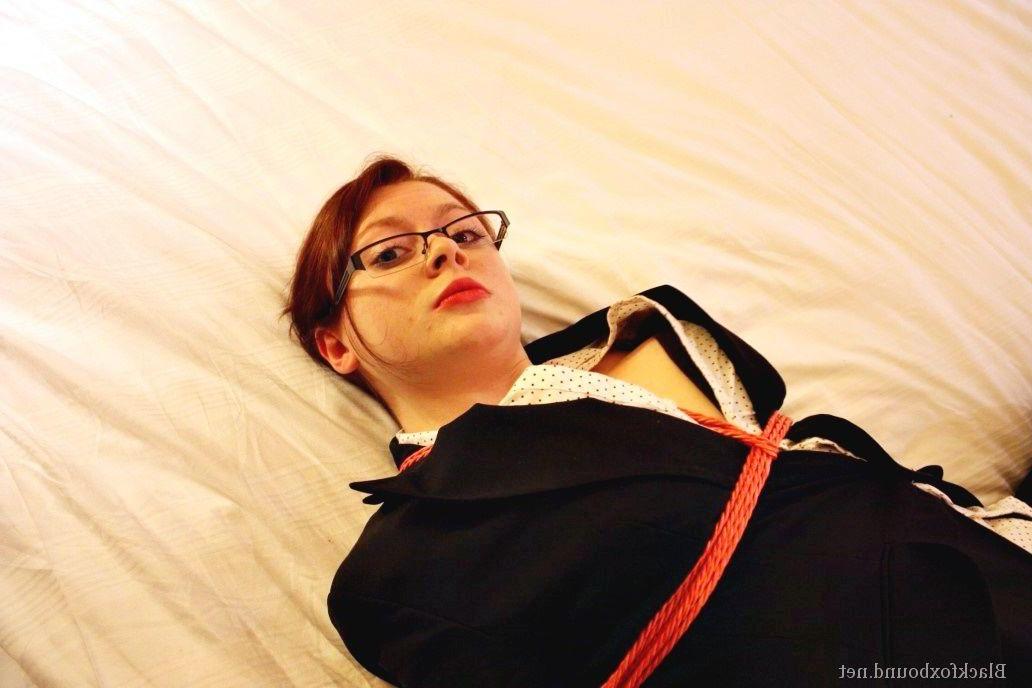 16P Natural redhead is tied up in her secretarial clothing and gagged as well