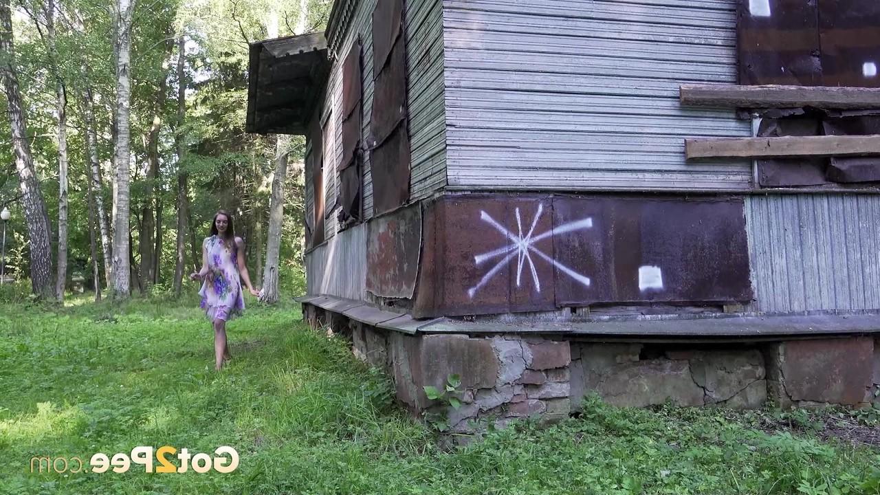 15P Solo girl climbs a set of outdoor stairs before taking a piss