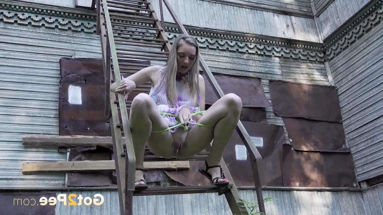 15P Solo girl climbs a set of outdoor stairs before taking a piss