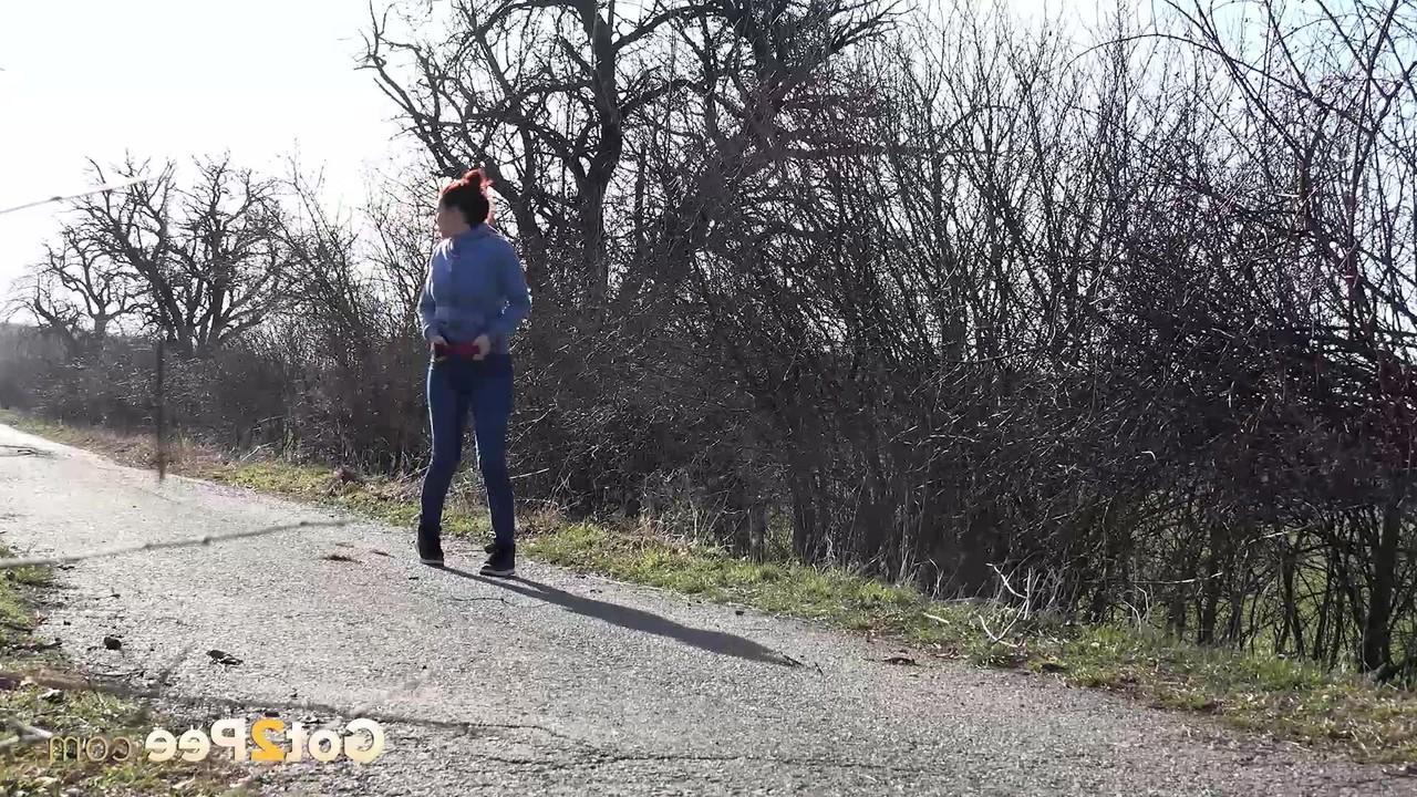 15P Natural redhead Antonia Sainz takes a pee on a road in the countryside