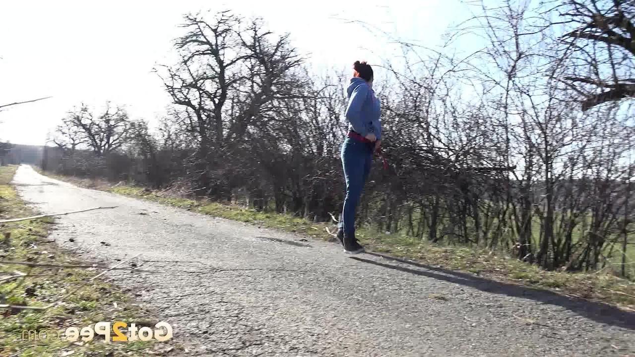 15P Natural redhead Antonia Sainz takes a pee on a road in the countryside