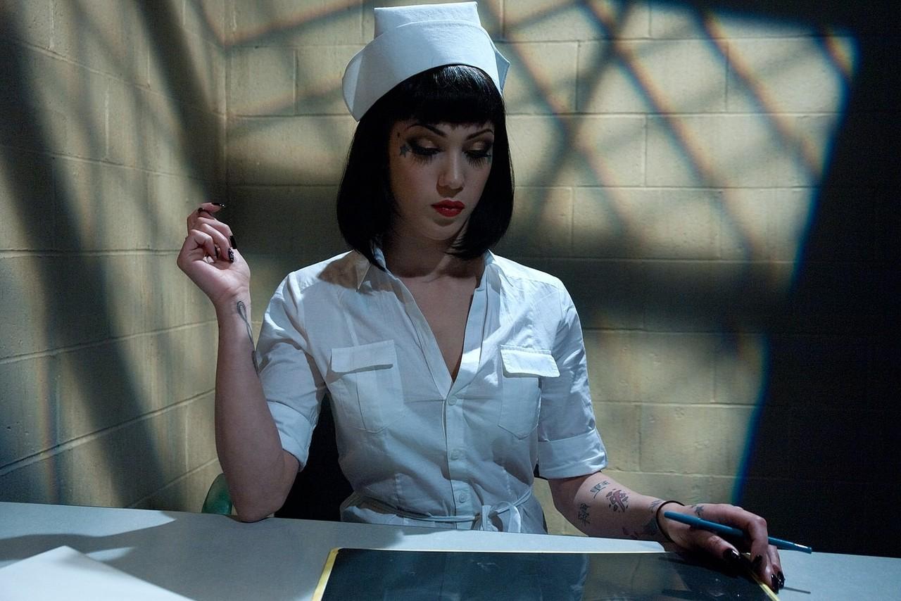 20P Slutty dark haired nurse shows her amazing ass and big tits at the hospital