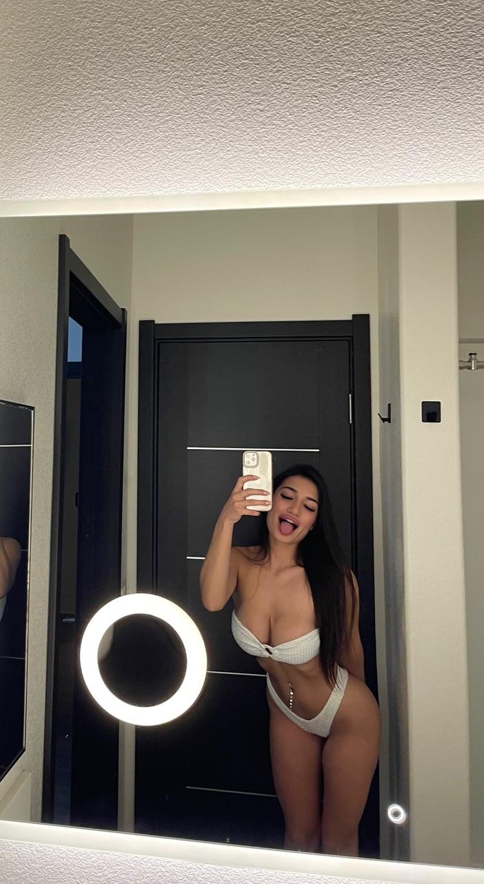19P Brunette babe Maddie Gech teases with her amazing ass and shows her breasts