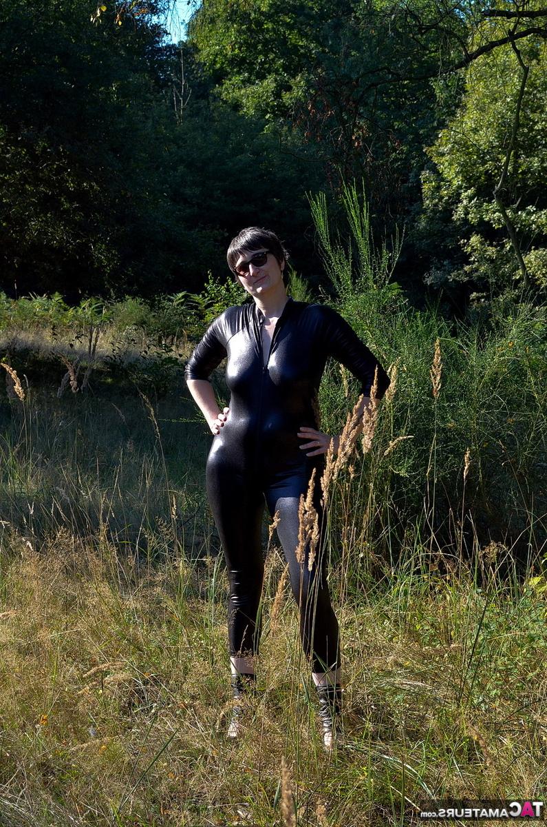 16P Brunette amateur Hot MILF unzips a catsuit to show her natural tits