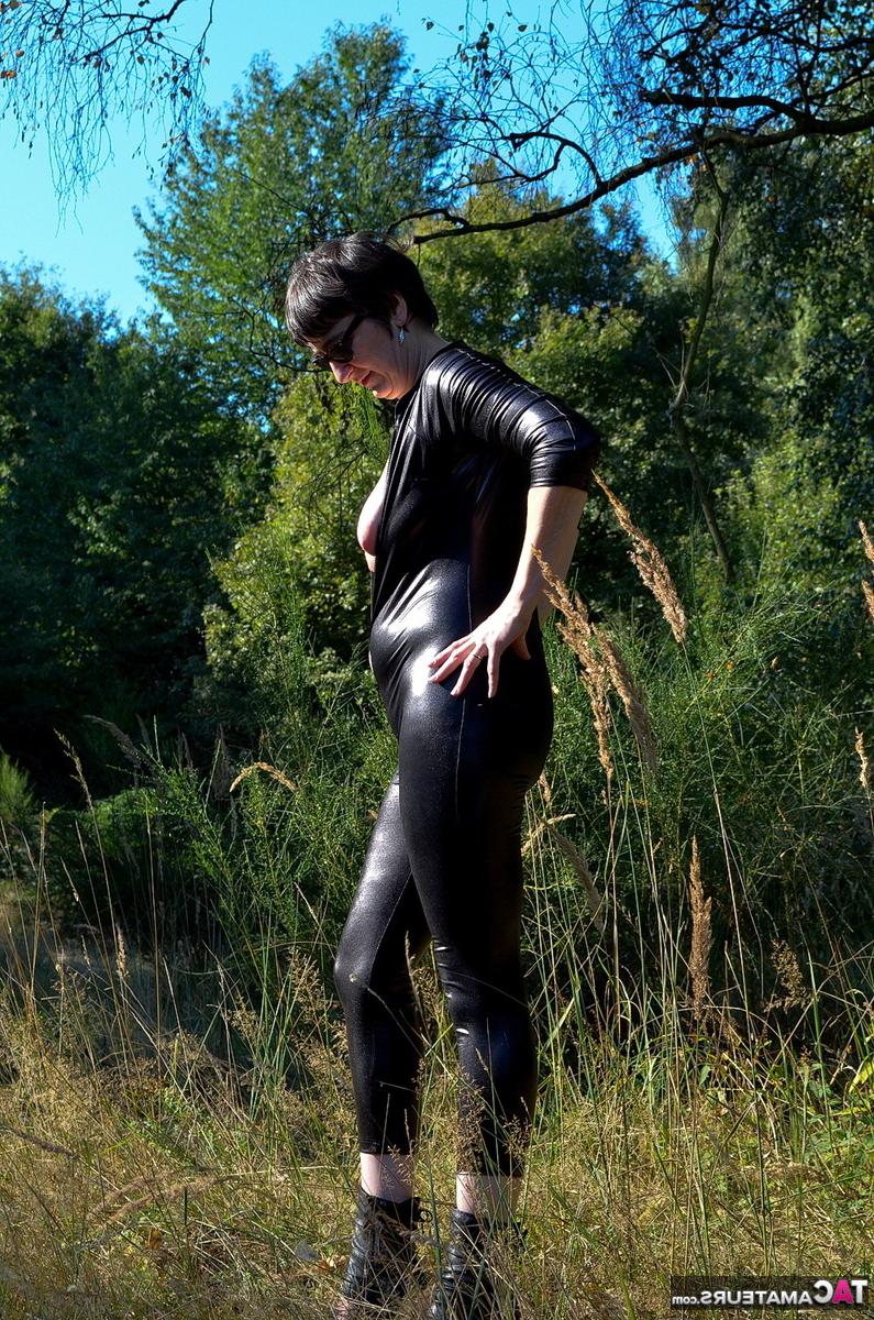 16P Brunette amateur Hot MILF unzips a catsuit to show her natural tits