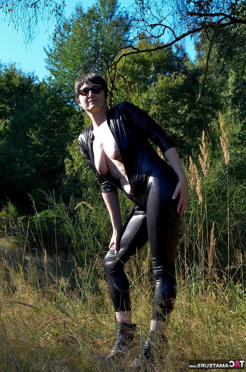 16P Brunette amateur Hot MILF unzips a catsuit to show her natural tits