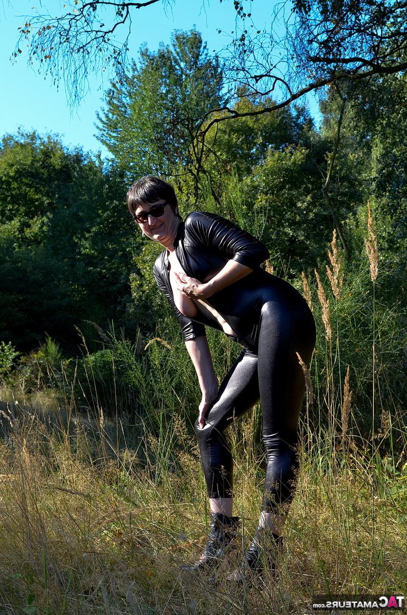 16P Brunette amateur Hot MILF unzips a catsuit to show her natural tits