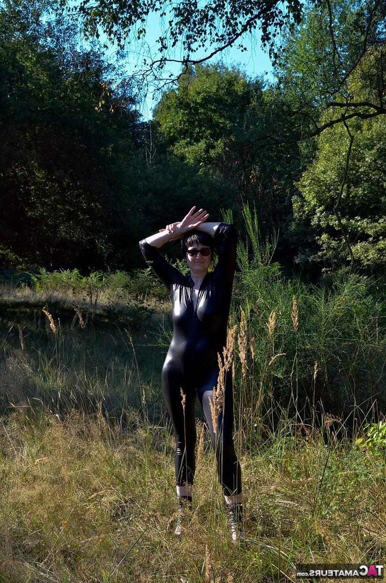16P Brunette amateur Hot MILF unzips a catsuit to show her natural tits