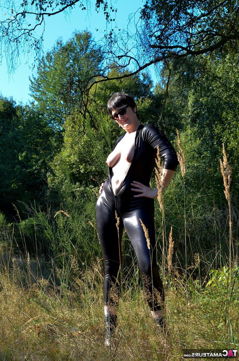 16P Brunette amateur Hot MILF unzips a catsuit to show her natural tits