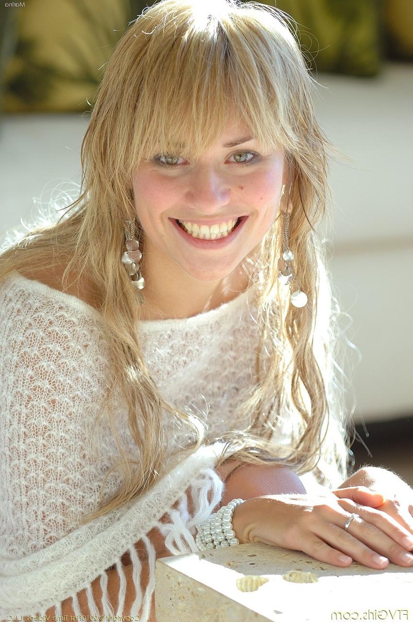 20P Blonde babe with a beautiful smile Marina exposing her sweet natural tits