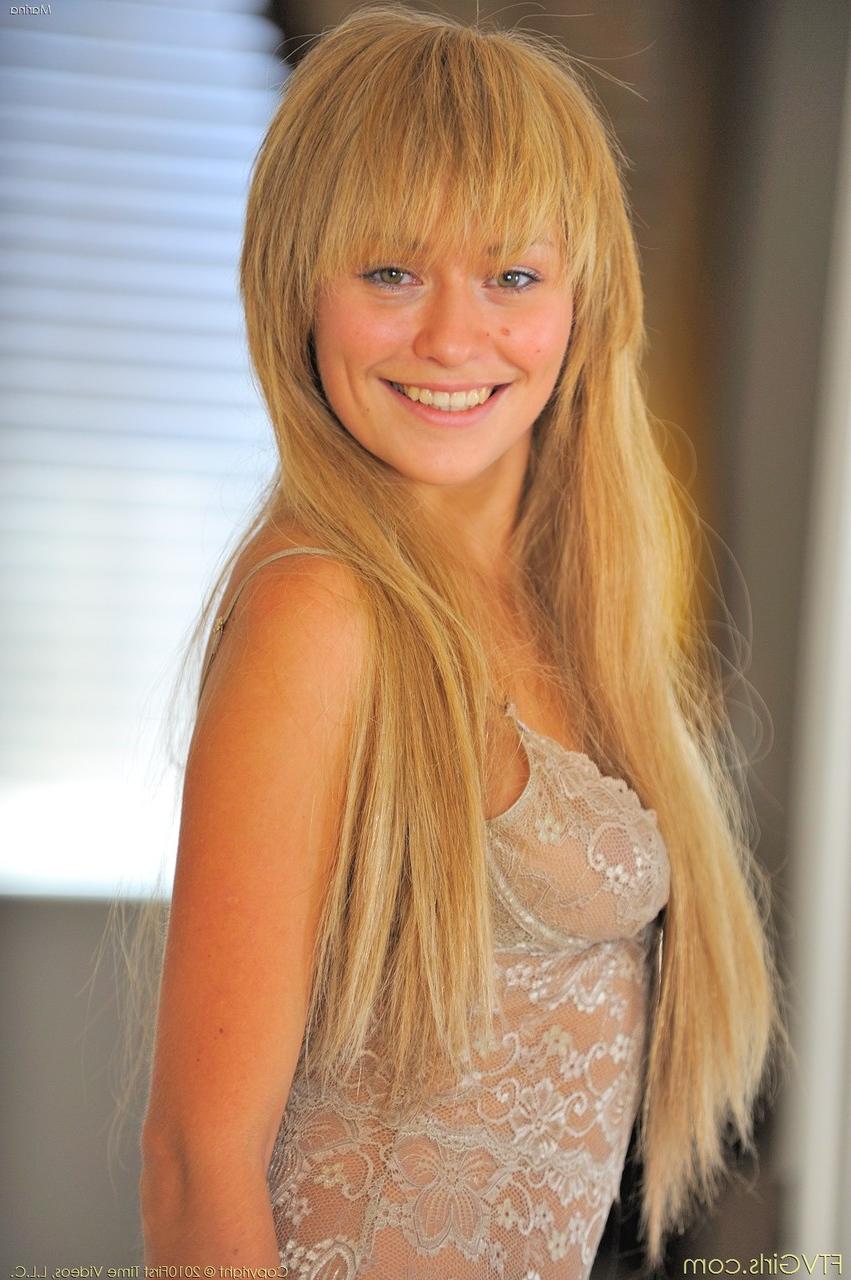 20P Blonde babe with a beautiful smile Marina exposing her sweet natural tits