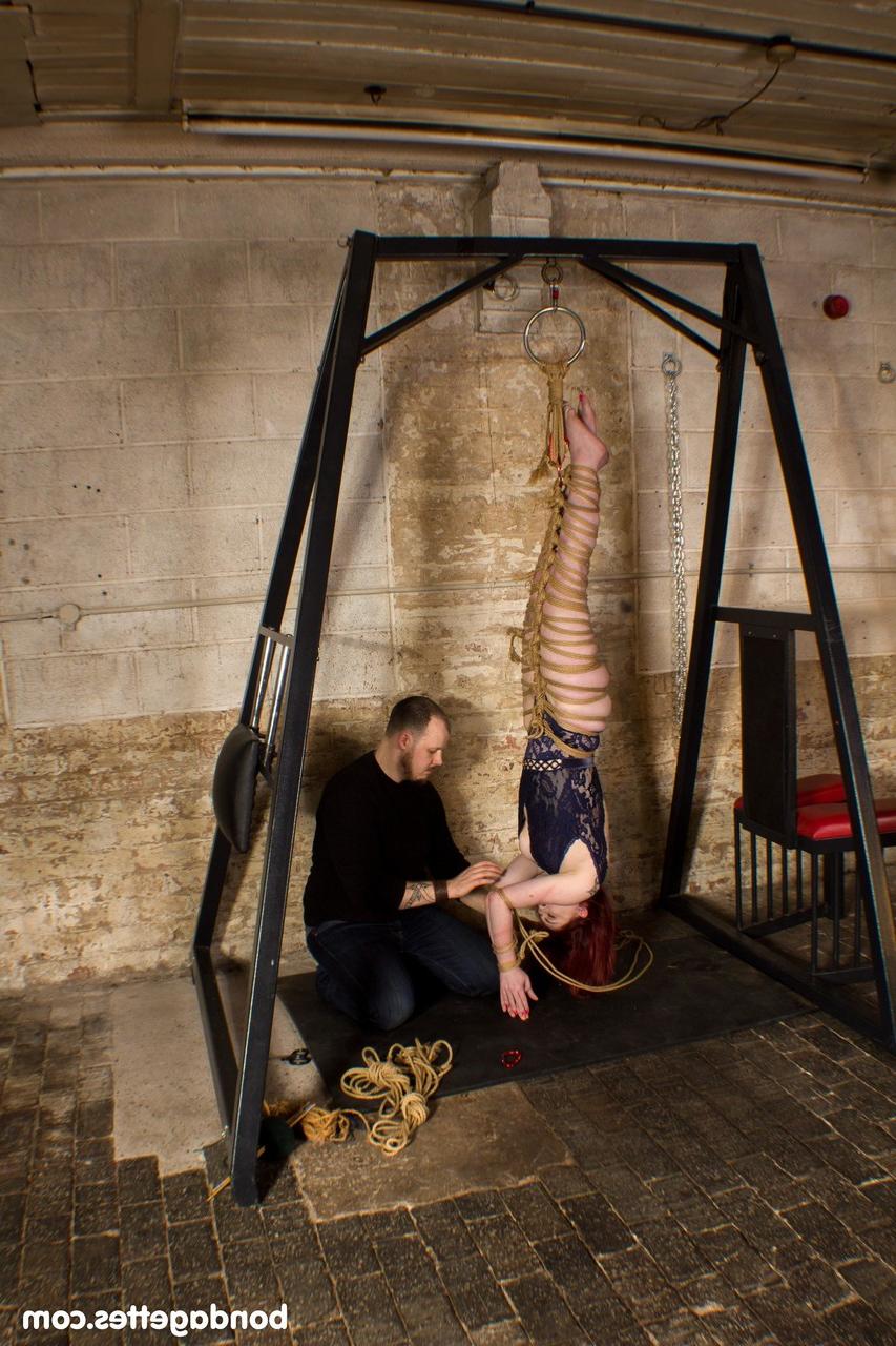 20P Submissive redheaded babe Louise Red gets her hands & legs tied in BDSM action