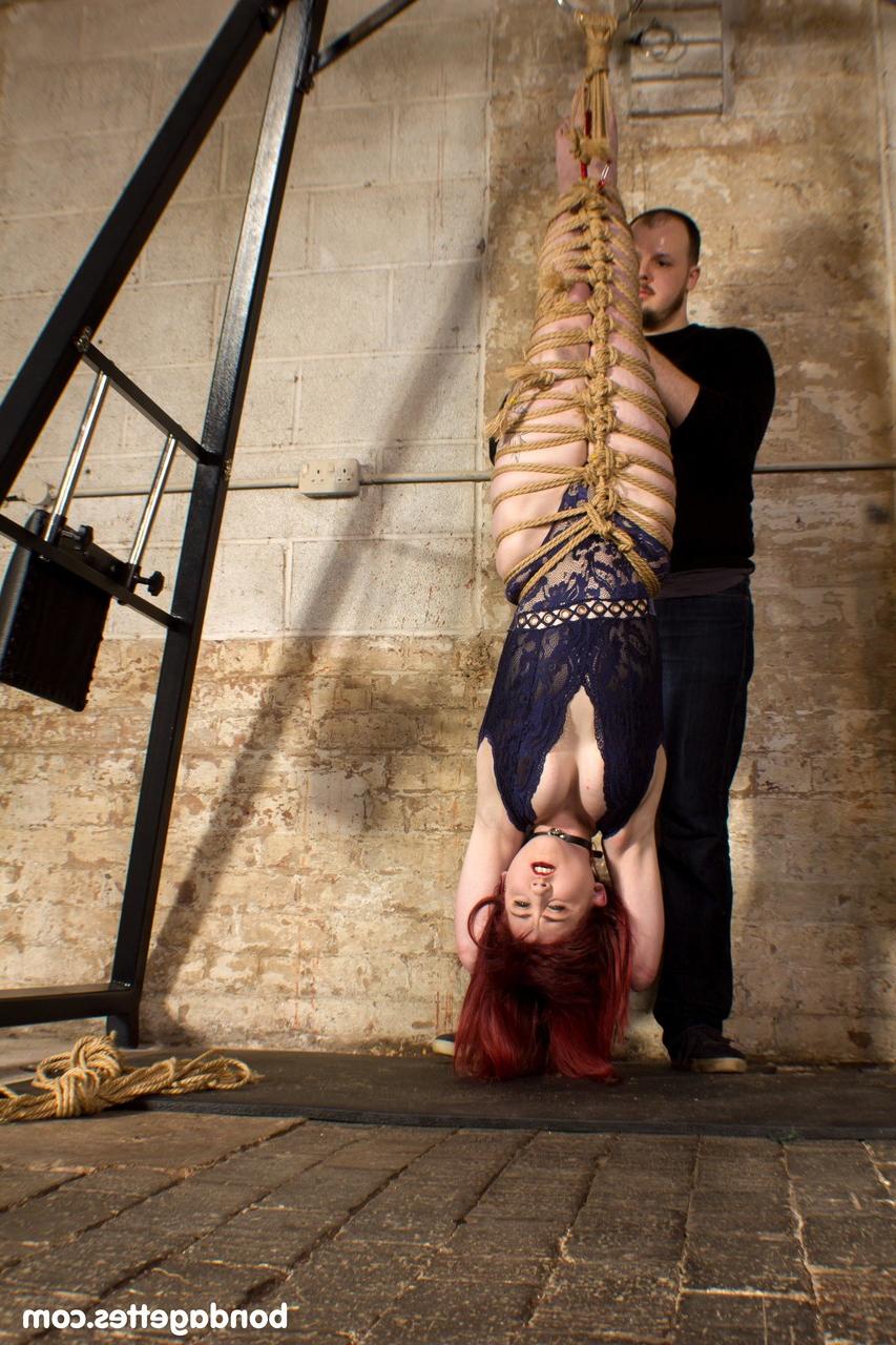 20P Submissive redheaded babe Louise Red gets her hands & legs tied in BDSM action