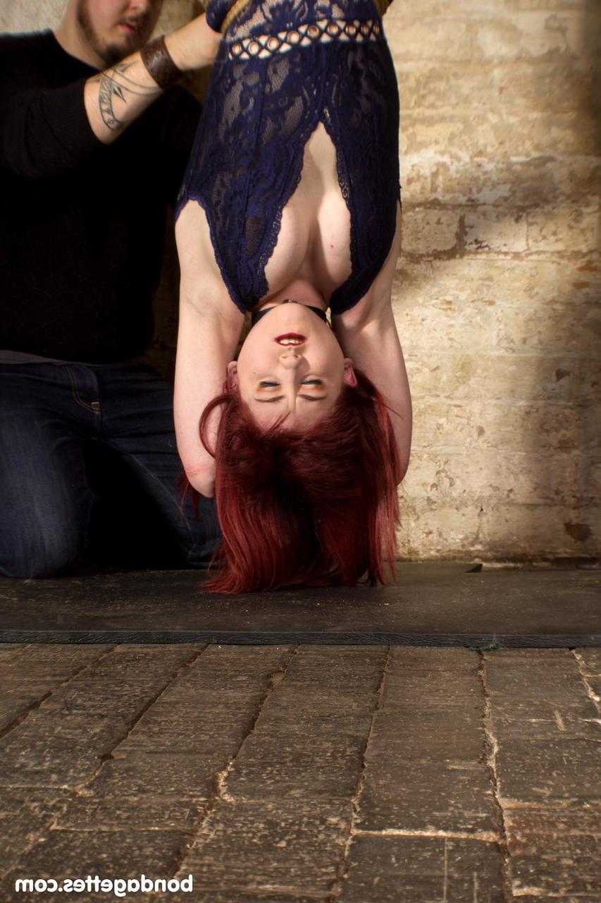 20P Submissive redheaded babe Louise Red gets her hands & legs tied in BDSM action
