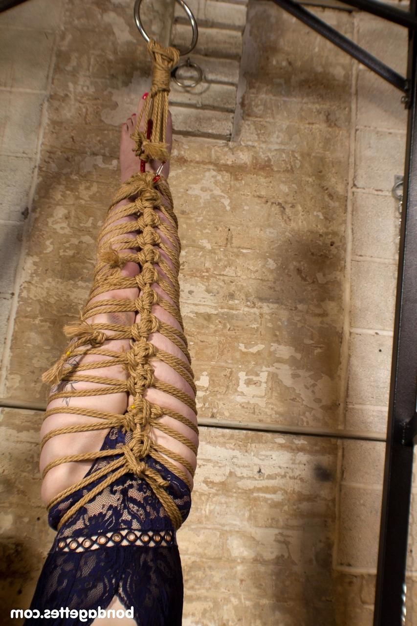 20P Submissive redheaded babe Louise Red gets her hands & legs tied in BDSM action