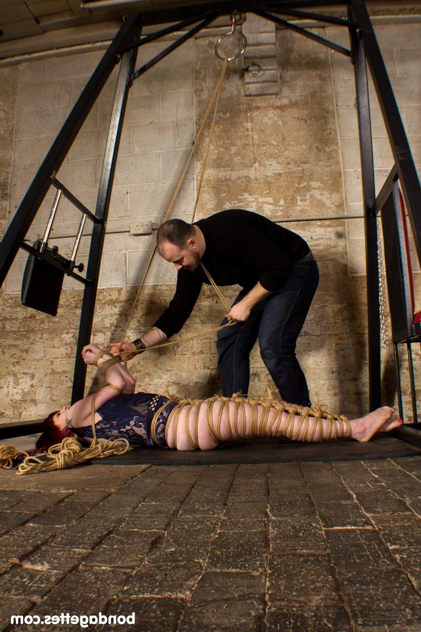 20P Submissive redheaded babe Louise Red gets her hands & legs tied in BDSM action