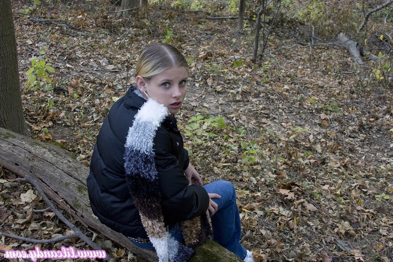 16P Adorable babe Lil Candy stripping in the forest and showing her puffy pussy
