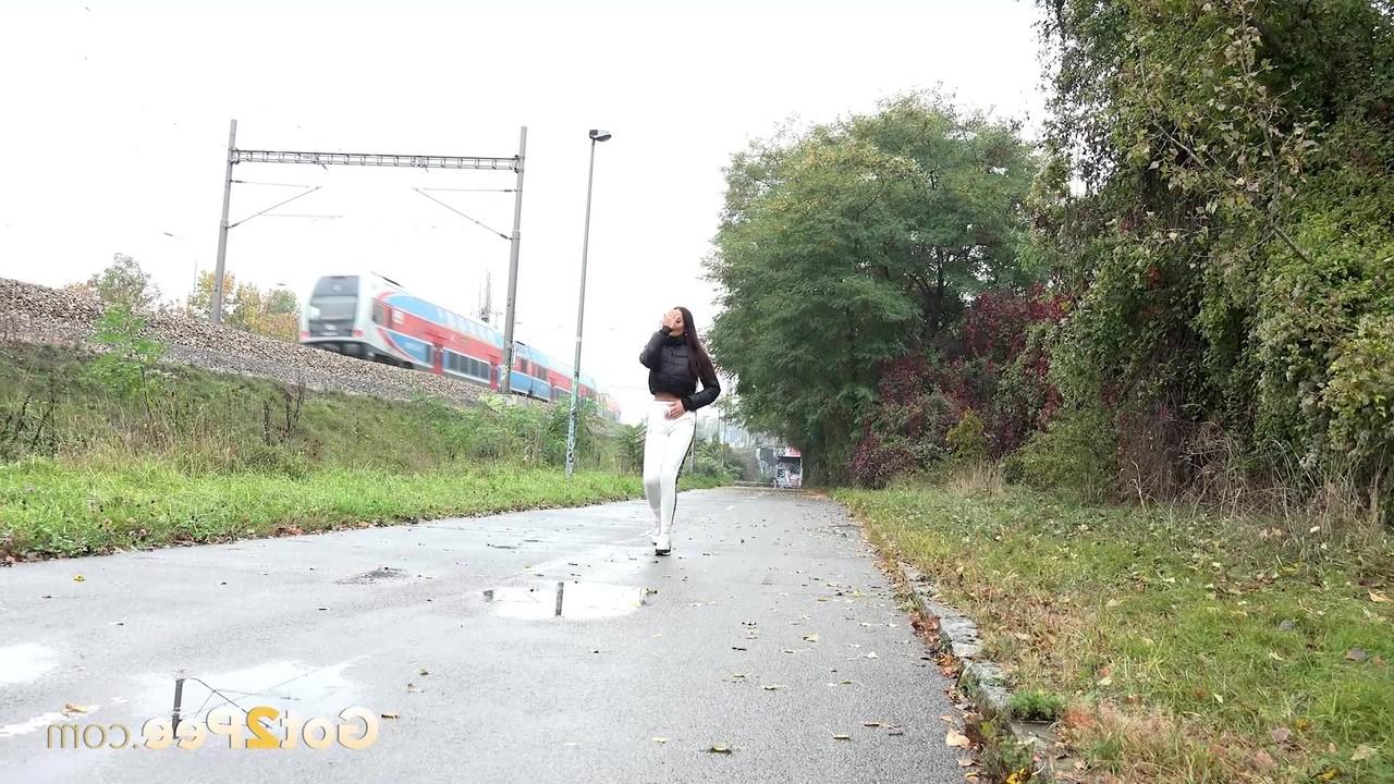 14P Maddi Black pulls down her pants before pissing in a puddle