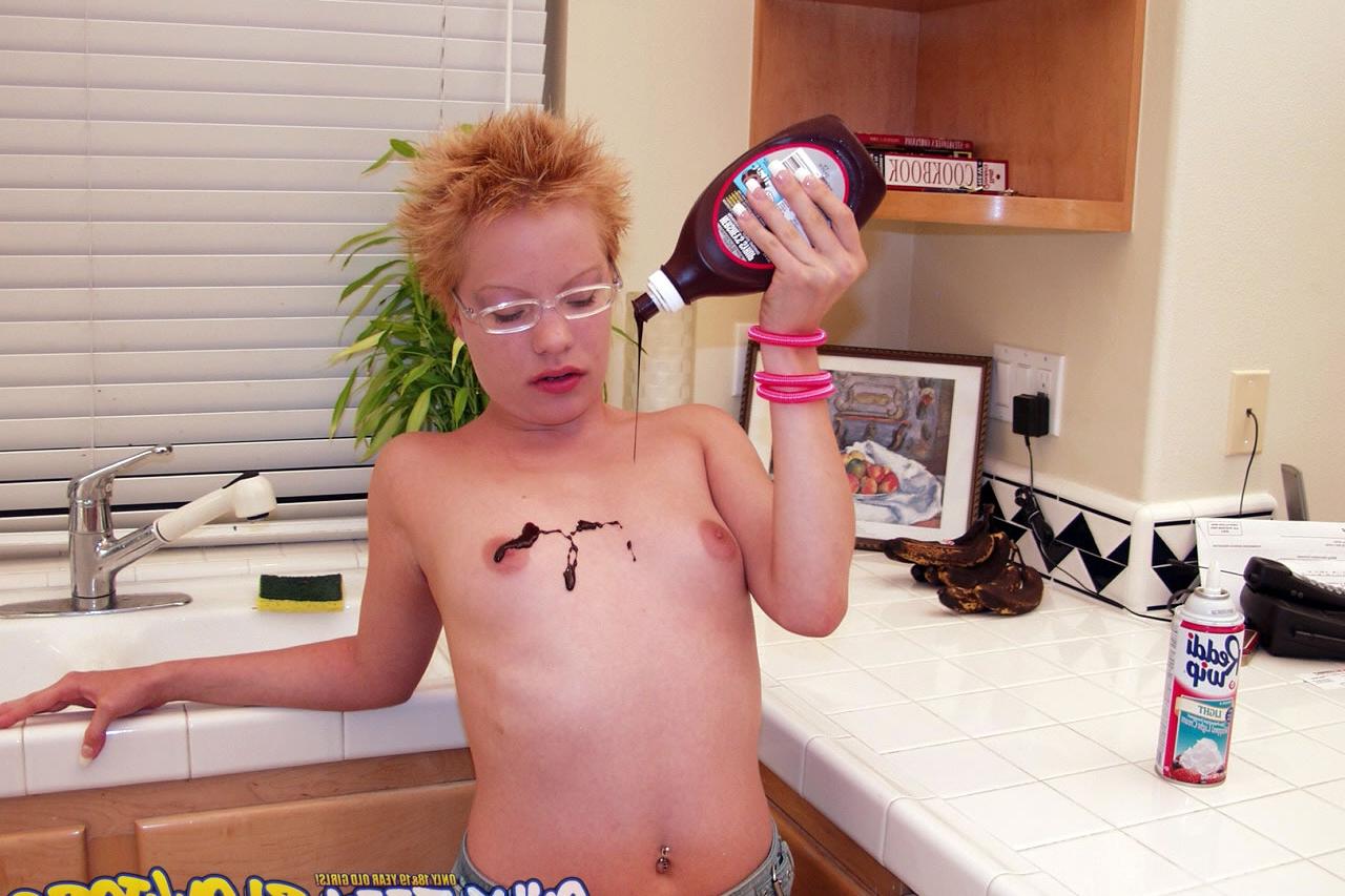 20P Naughty redhead Emily Davinci goes topless & indulges in a food play solo